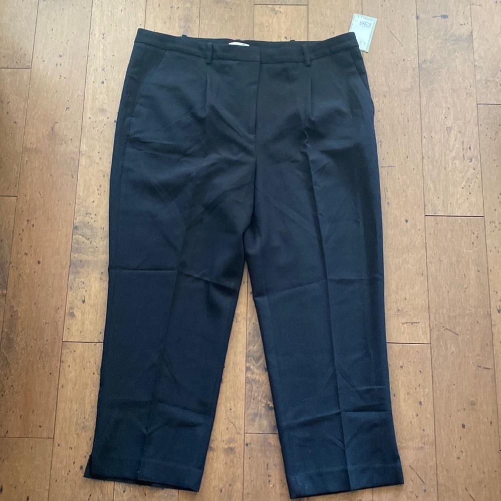 Black dress pants. Button and zip closure.